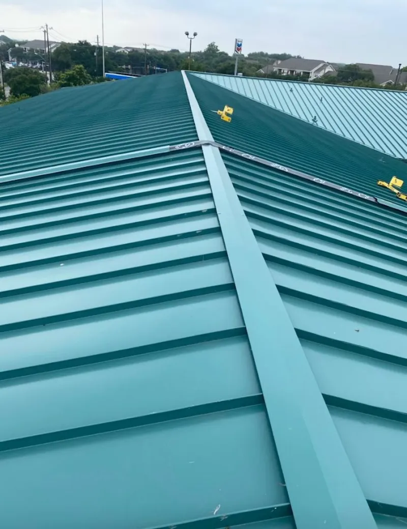 Green commercial metal roof ridge and valley for Metal Roof Repair in Cornwall